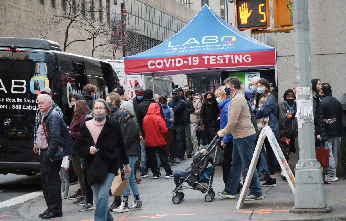 People line up at a COVID testing center in New York as Omicron threatens to shut down sports again.