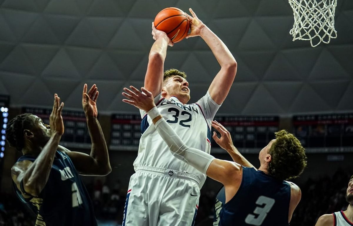 Nov 27, 2023; Storrs, Connecticut, USA; UConn Huskies center Donovan Clingan (32) shoots against New Hampshire Wildcats forward Jaxson Baker (3) in the first half at Harry A. Gampel Pavilion.