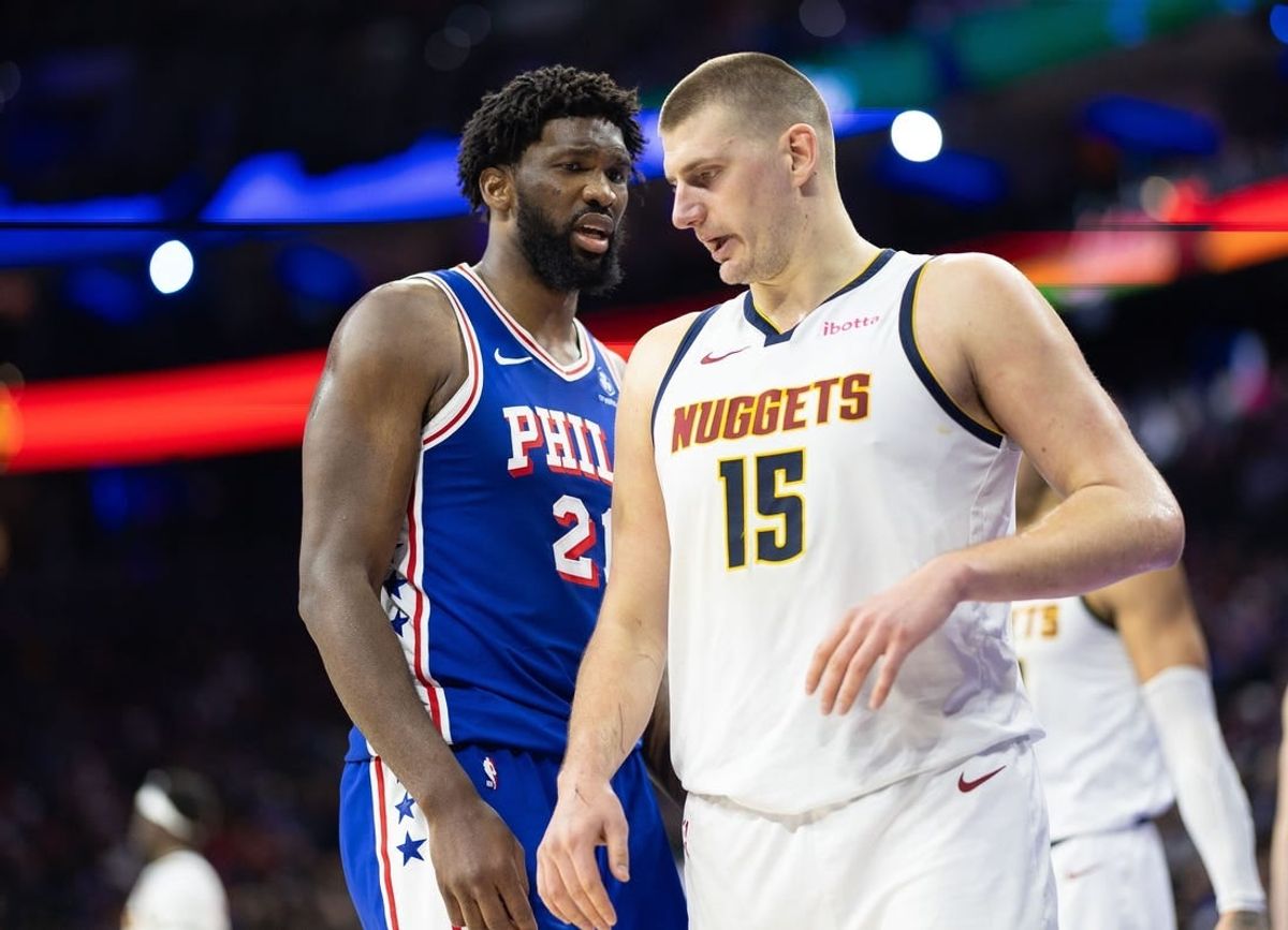 Jan 16, 2024; Philadelphia, Pennsylvania, USA; Philadelphia 76ers center Joel Embiid (21) glances at Denver Nuggets center Nikola Jokic (15) during a break in action in the third quarter at Wells Fargo Center.