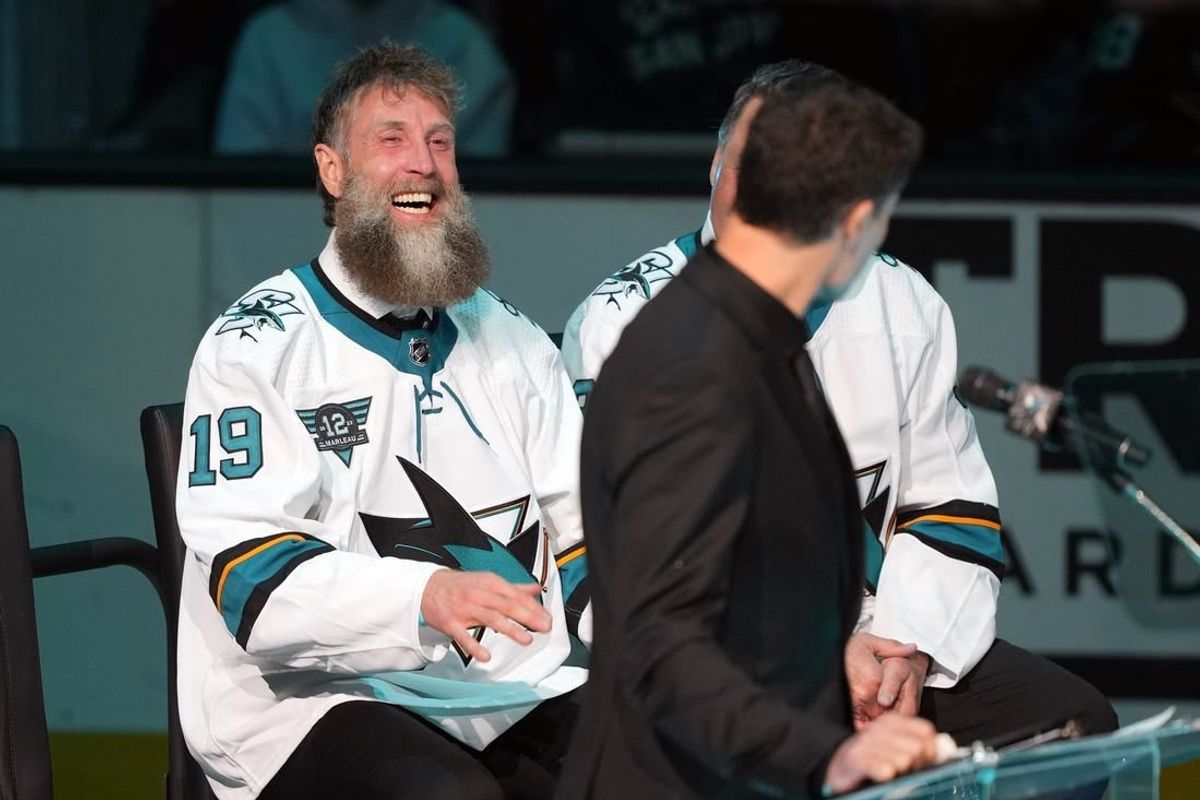 Feb 25, 2023; San Jose, California, USA; San Jose Sharks former player Joe Thornton laughs during the Patrick Marleau jersey retirement ceremony before the game against the Chicago Blackhawks at SAP Center at San Jose.