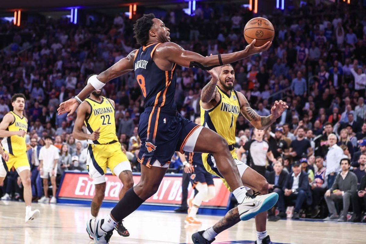 May 8, 2024; New York, New York, USA; New York Knicks forward OG Anunoby (8) drives past Indiana Pacers forward Obi Toppin (1) in the third quarter during game two of the second round for the 2024 NBA playoffs at Madison Square Garden.