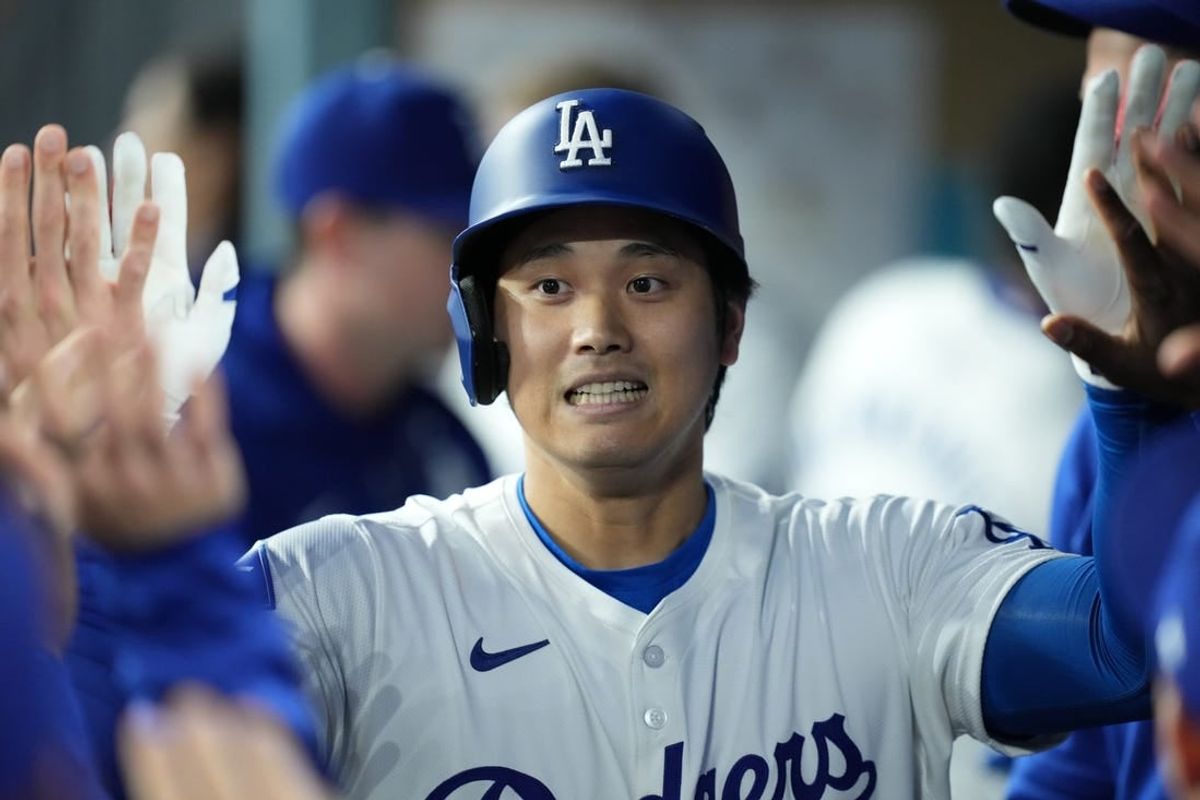 Apr 12, 2024; Los Angeles, California, USA; Los Angeles Dodgers designated hitter Shohei Ohtani (17) reacts after hitting a solo home run in the first inning against the San Diego Padres at Dodger Stadium.