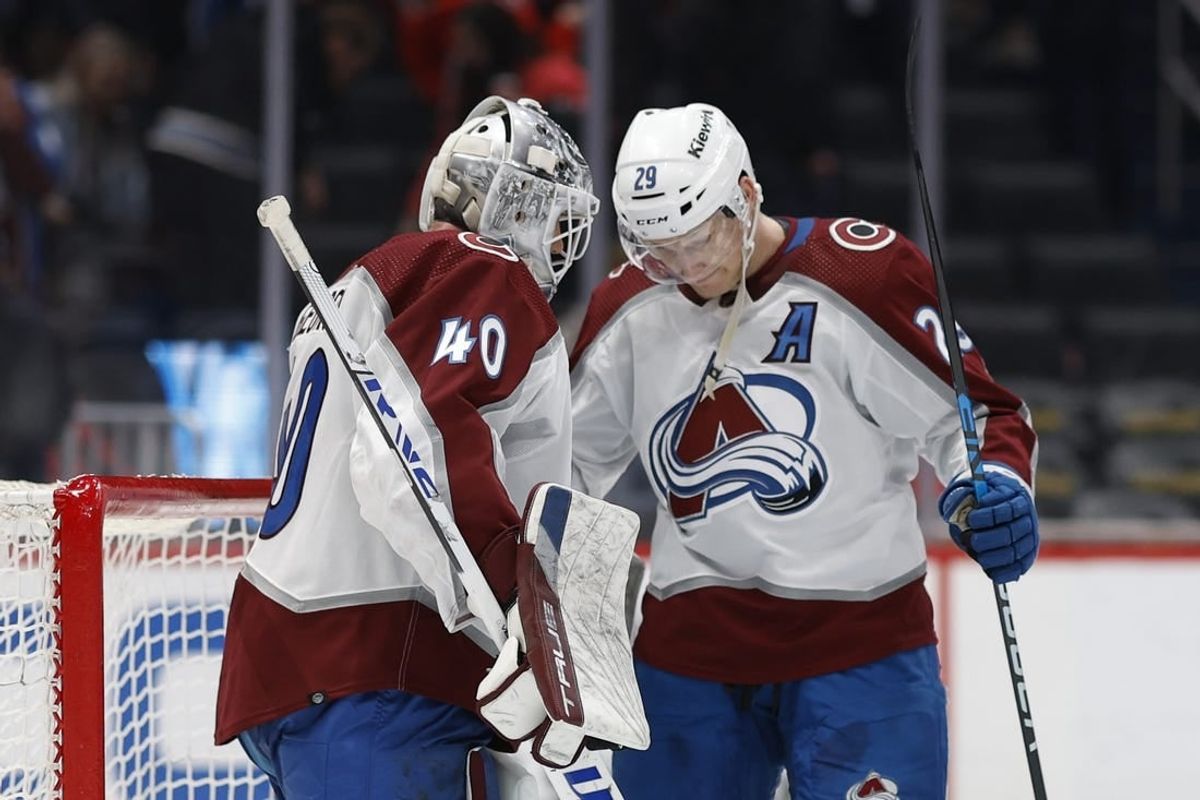 Feb 13, 2024; Washington, District of Columbia, USA; Colorado Avalanche goaltender Alexandar Georgiev (40) celebrates wth Avalanche center Nathan MacKinnon (29) after their game against the Washington Capitals at Capital One Arena.