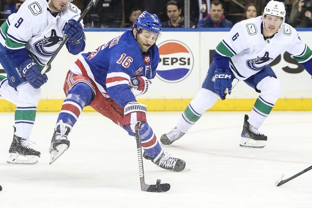 Jan 8, 2024; New York, New York, USA;  New York Rangers center Vincent Trocheck (16) controls the puck in the first period against the Vancouver Canucks at Madison Square Garden.