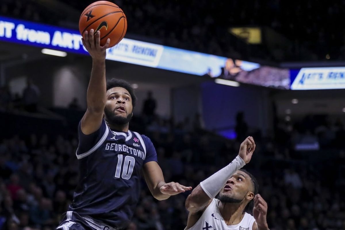 Jan 19, 2024; Cincinnati, Ohio, USA; Georgetown Hoyas guard Jayden Epps (10) shoots against Xavier Musketeers guard Dayvion McKnight (20) in the second half at Cintas Center.