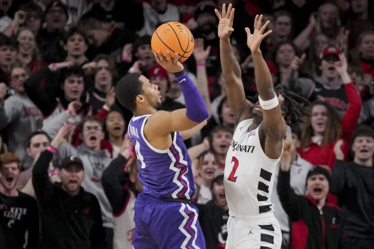 Jan 16, 2024; Cincinnati, Ohio, USA;  TCU Horned Frogs guard Jameer Nelson Jr. (4) drives to the basket against Cincinnati Bearcats guard Jizzle James (2) in the first half at Fifth Third Arena.