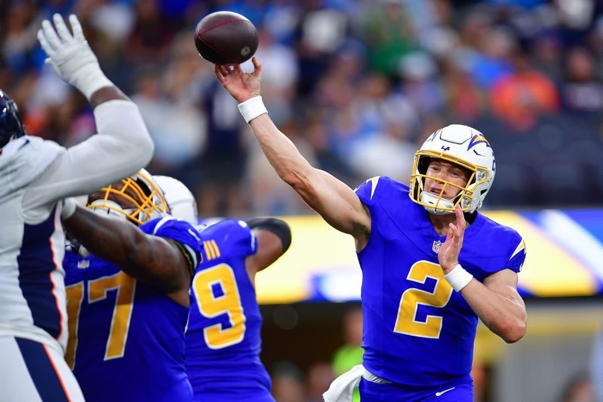 Dec 10, 2023; Inglewood, California, USA; Los Angeles Chargers quarterback Easton Stick (2) throws against the Denver Broncos during the second half at SoFi Stadium.