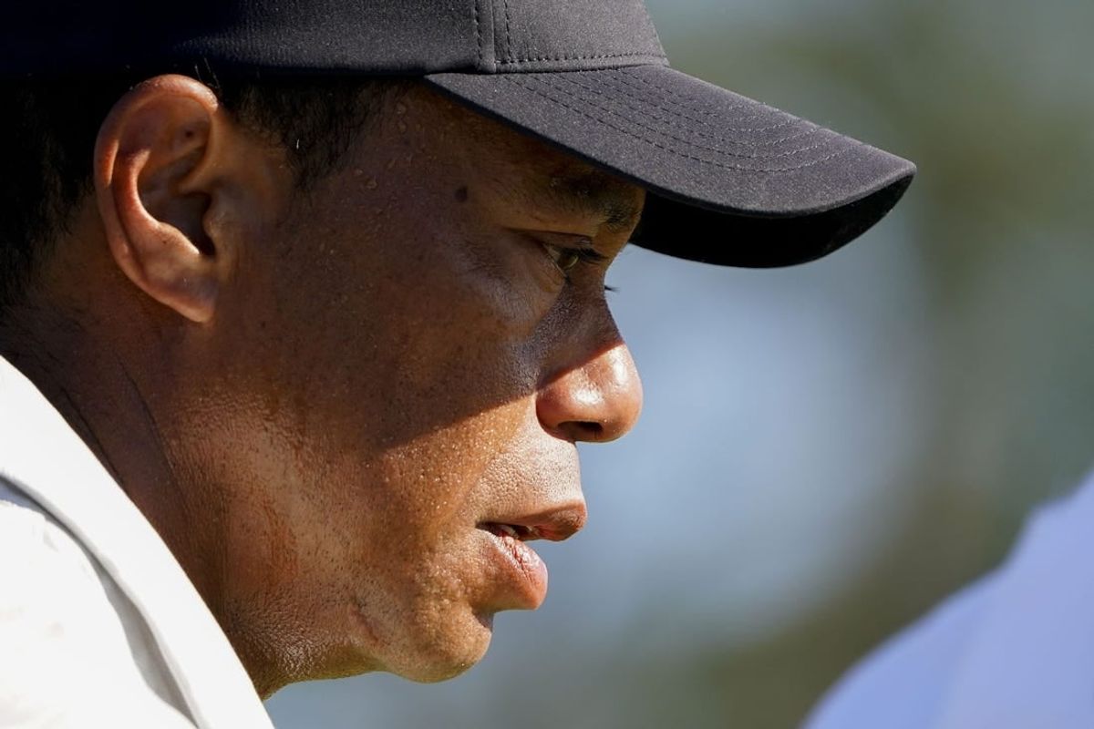 Apr 13, 2024; Augusta, Georgia, USA; Tiger Woods walks off the No. 18 green during the third round of the Masters Tournament.