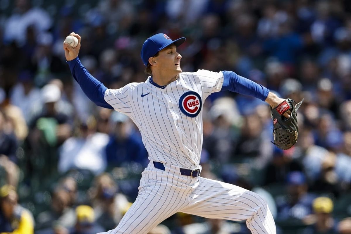 May 3, 2024; Chicago, Illinois, USA; Chicago Cubs starting pitcher Hayden Wesneski (19) delivers a pitch against the Milwaukee Brewers during the first inning at Wrigley Field.