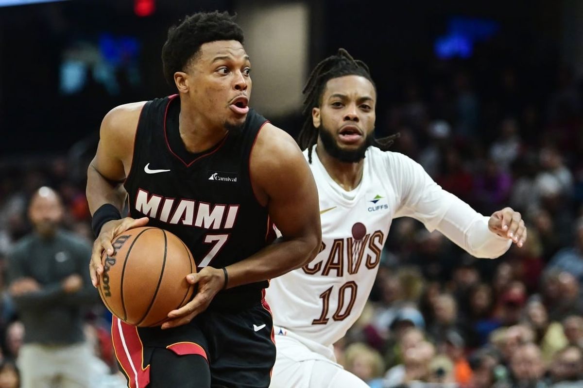 Nov 22, 2023; Cleveland, Ohio, USA; Miami Heat guard Kyle Lowry (7) drives to the basket against Cleveland Cavaliers guard Darius Garland (10) during the first half at Rocket Mortgage FieldHouse.