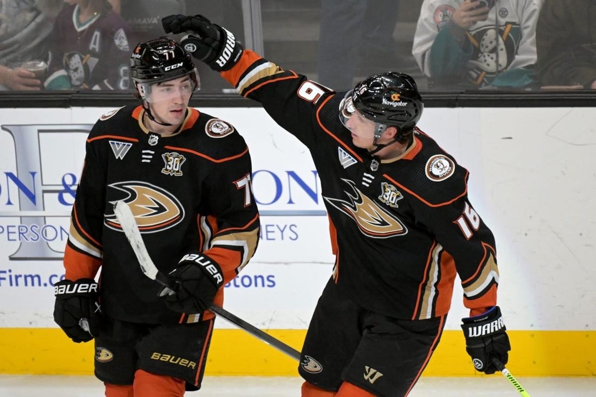 Mar 21, 2024; Anaheim, California, USA;  Anaheim Ducks right wing Frank Vatrano (77) is congratulated by center Ryan Strome (16) after scoring a goal in the third period against the Chicago Blackhawks at Honda Center.