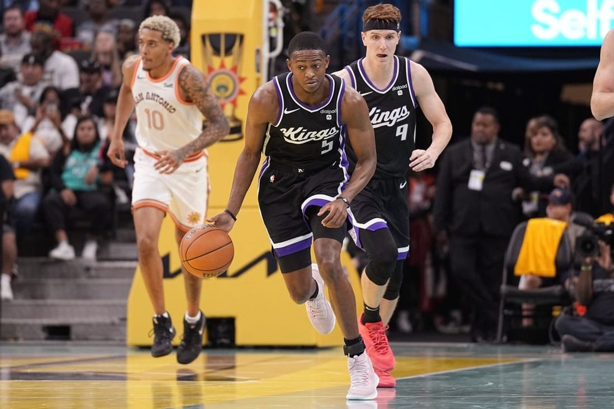 Nov 17, 2023; San Antonio, Texas, USA; Sacramento Kings guard De'Aaron Fox (5) dribbles up court  during the second half against the San Antonio Spurs at Frost Bank Center.