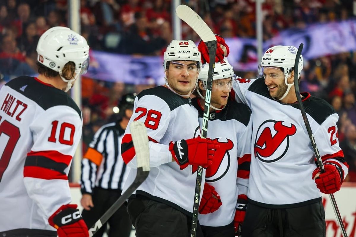 Dec 9, 2023; Calgary, Alberta, CAN; New Jersey Devils right wing Timo Meier (28) celebrates his goal with teammates against the Calgary Flames during the third period at Scotiabank Saddledome.