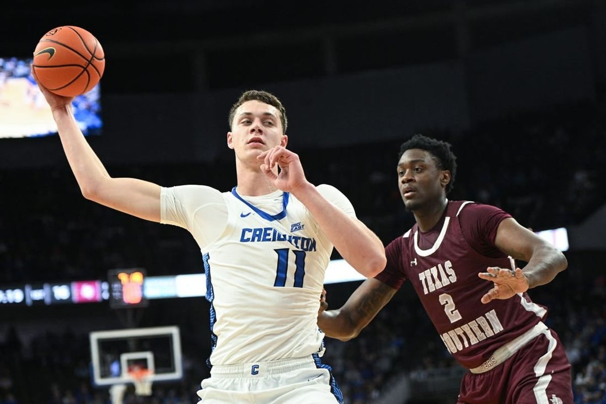 Nov 18, 2023; Omaha, Nebraska, USA;  Creighton Bluejays center Ryan Kalkbrenner (11) looks to drive against Texas Southern Tigers forward Jahmar Young Jr. (2) in the first half at CHI Health Center Omaha.