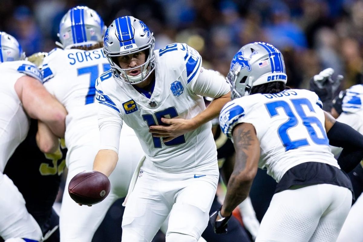 Dec 3, 2023; New Orleans, Louisiana, USA; Detroit Lions quarterback Jared Goff (16) hands off to running back Jahmyr Gibbs (26) against the New Orleans Saints during the first half at the Caesars Superdome.