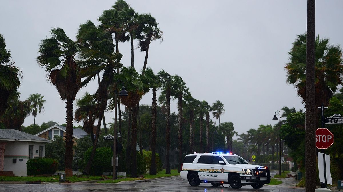 A police patrol drives around a neighborhood of St. Pete Beach as the winds from Hurricane Ian arrive on September 28, 2022 in St. Petersburg, Florida
