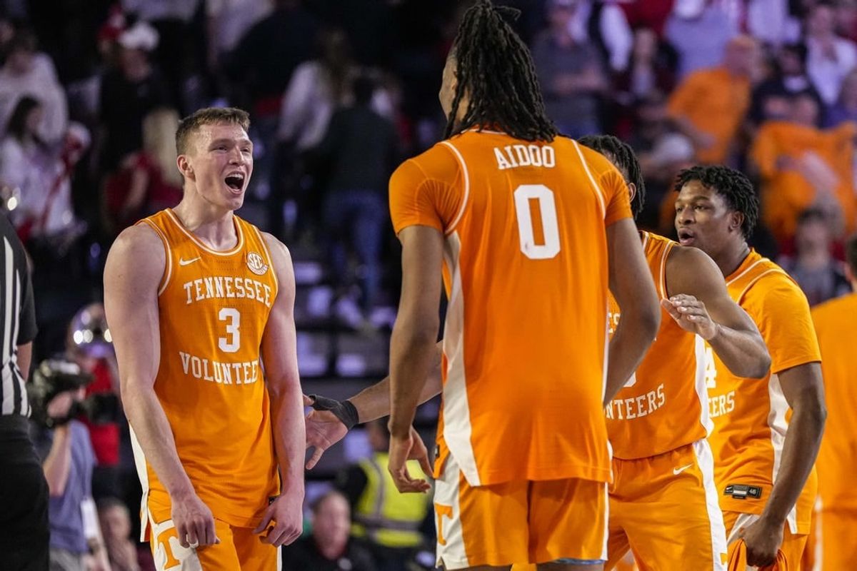 Jan 13, 2024; Athens, Georgia, USA; Tennessee Volunteers guard Dalton Knecht (3) reacts with forward Jonas Aidoo (0) after defeating the Georgia Bulldogs at Stegeman Coliseum.