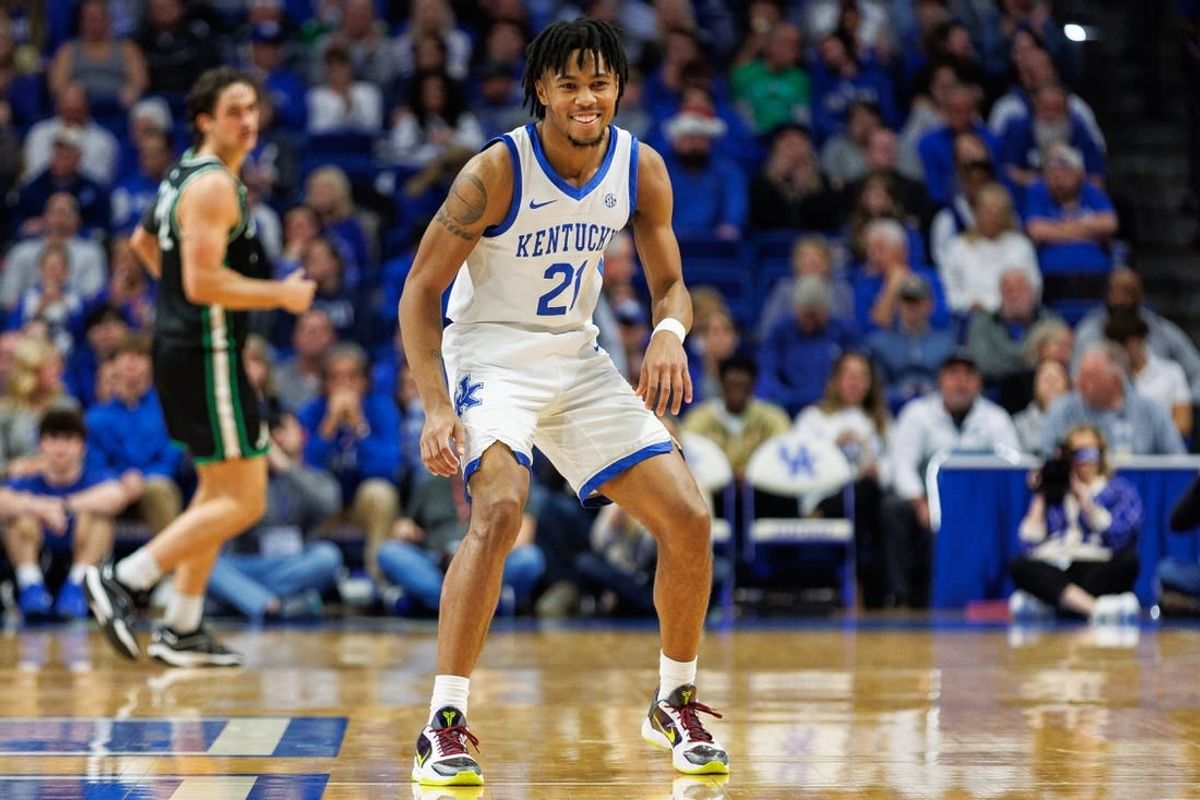Nov 24, 2023; Lexington, Kentucky, USA; Kentucky Wildcats guard D.J. Wagner (21) smiles during the second half against the Marshall Thundering Herd at Rupp Arena at Central Bank Center.