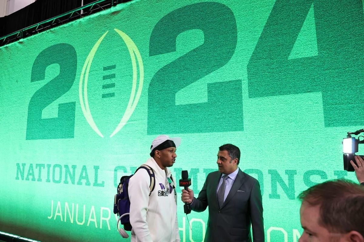 Jan 6, 2024; Houston, TX, USA; Washington Huskies quarterback Michael Penix Jr. (9) talks to the media during media day before the College Football Playoff national championship game against the Michigan Wolverines at George R Brown Convention Center.