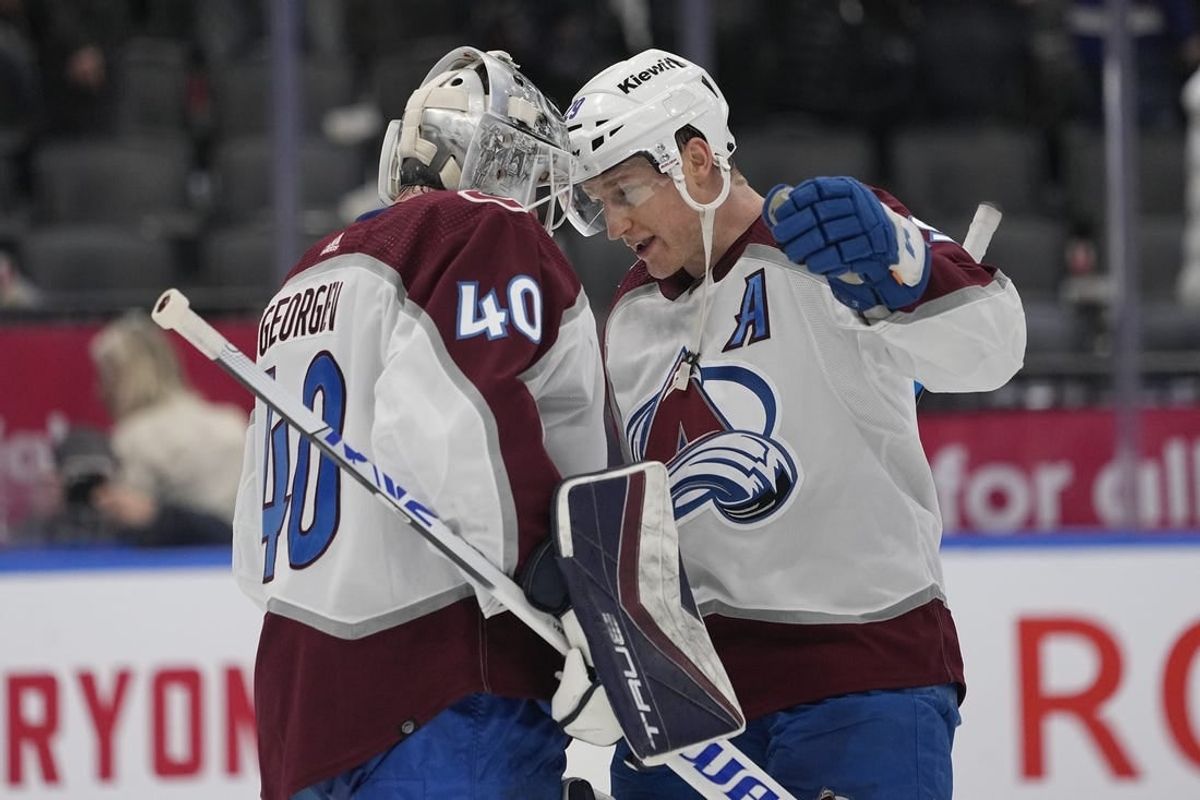 Jan 13, 2024; Toronto, Ontario, CAN; Colorado Avalanche forward Nathan MacKinnon (29) and goaltender Alexandar Georgiev (40) celebrate a win over the Toronto Maple Leafs during the third period at Scotiabank Arena.