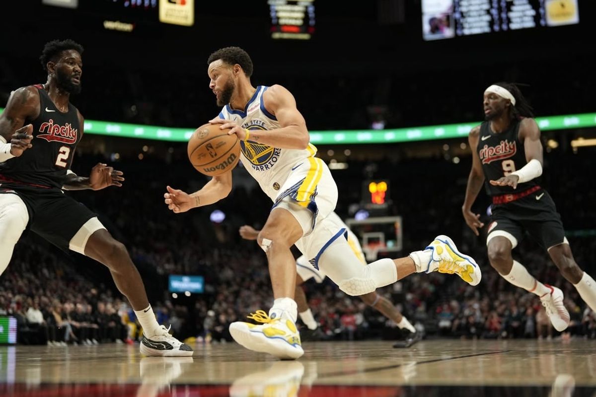 Dec 17, 2023; Portland, Oregon, USA; Golden State Warriors point guard Stephen Curry (30) dribbles the ball as Portland Trail Blazers center Deandre Anton (2) defends during the first half at Moda Center.