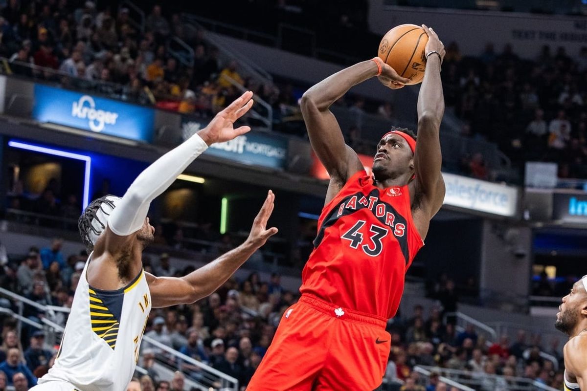 Nov 22, 2023; Indianapolis, Indiana, USA; Toronto Raptors forward Pascal Siakam (43) shoots the ball while Indiana Pacers guard Buddy Hield (left) defends in the first half at Gainbridge Fieldhouse.