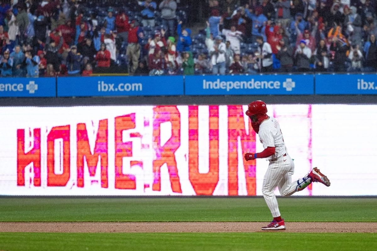 Apr 2, 2024; Philadelphia, Pennsylvania, USA; Philadelphia Phillies first baseman Bryce Harper (3) runs the bases after hitting a home run during the first inning against the Cincinnati Reds at Citizens Bank Park.