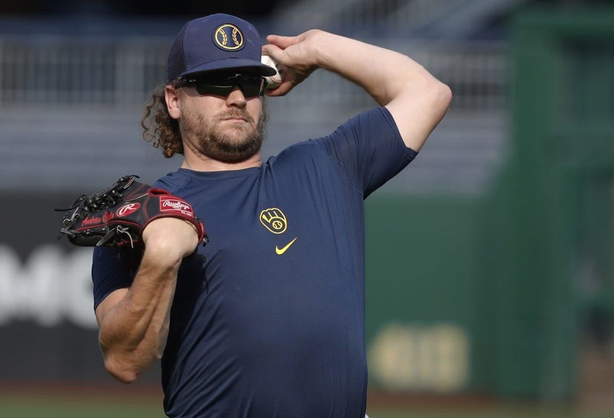 Sep 4, 2023; Pittsburgh, Pennsylvania, USA; Milwaukee Brewers relief pitcher Andrew Chafin (32) throws in the outfield before the game against the Pittsburgh Pirates at PNC Park.