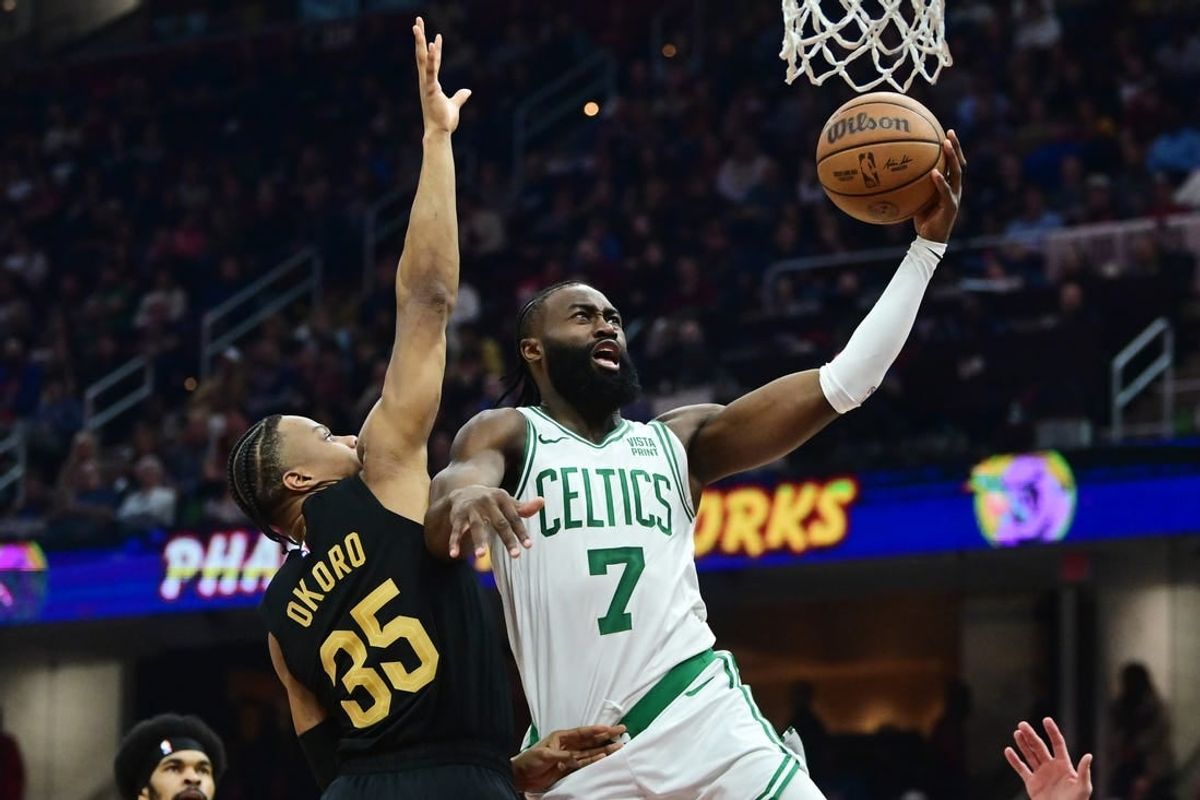 Mar 5, 2024; Cleveland, Ohio, USA;  Boston Celtics guard Jaylen Brown (7) drives to the basket against Cleveland Cavaliers forward Isaac Okoro (35) during the first half at Rocket Mortgage FieldHouse.