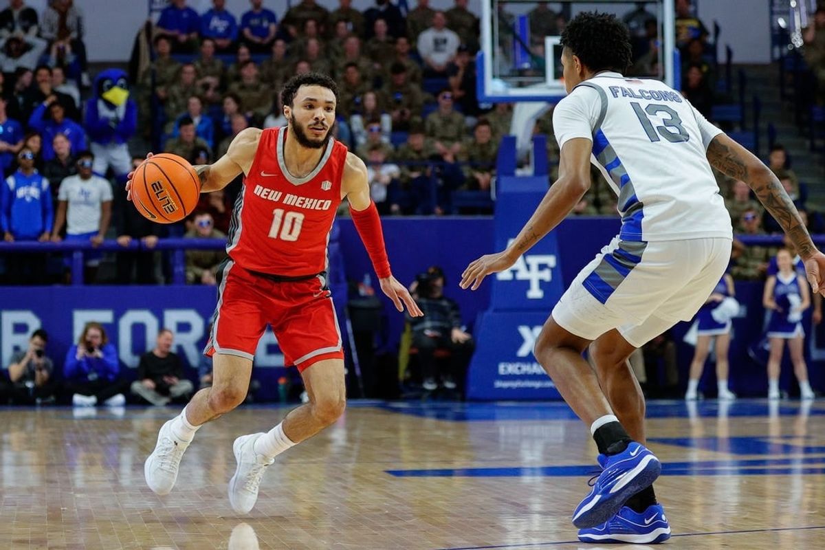 Jan 20, 2024; Colorado Springs, Colorado, USA; New Mexico Lobos guard Jaelen House (10) controls the ball as Air Force Falcons forward Chase Beasley (13) guards in the first half at Clune Arena.