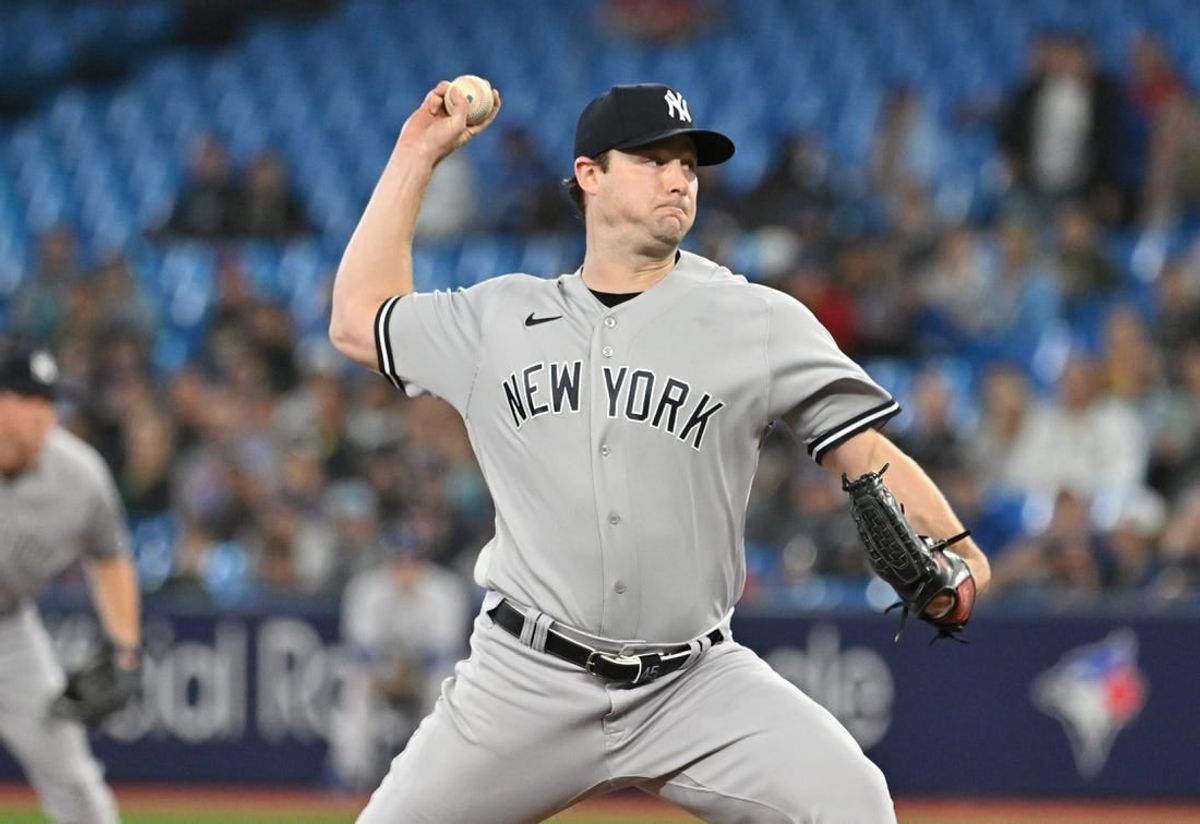 Sep 27, 2023; Toronto, Ontario, CAN; New York Yankee starting pitcher Gerrit Cole (45) delivers a pitch against the Toronto Blue Jays in the first inning at Rogers Centre.