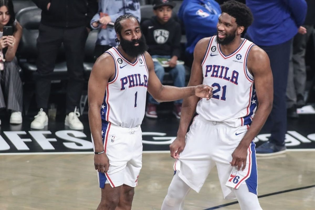Apr 20, 2023; Brooklyn, New York, USA; Philadelphia 76ers guard James Harden (1) talks with center Joel Embiid (21) during an official   s review during game three of the 2023 NBA playoffs against the Brooklyn Nets at Barclays Center.