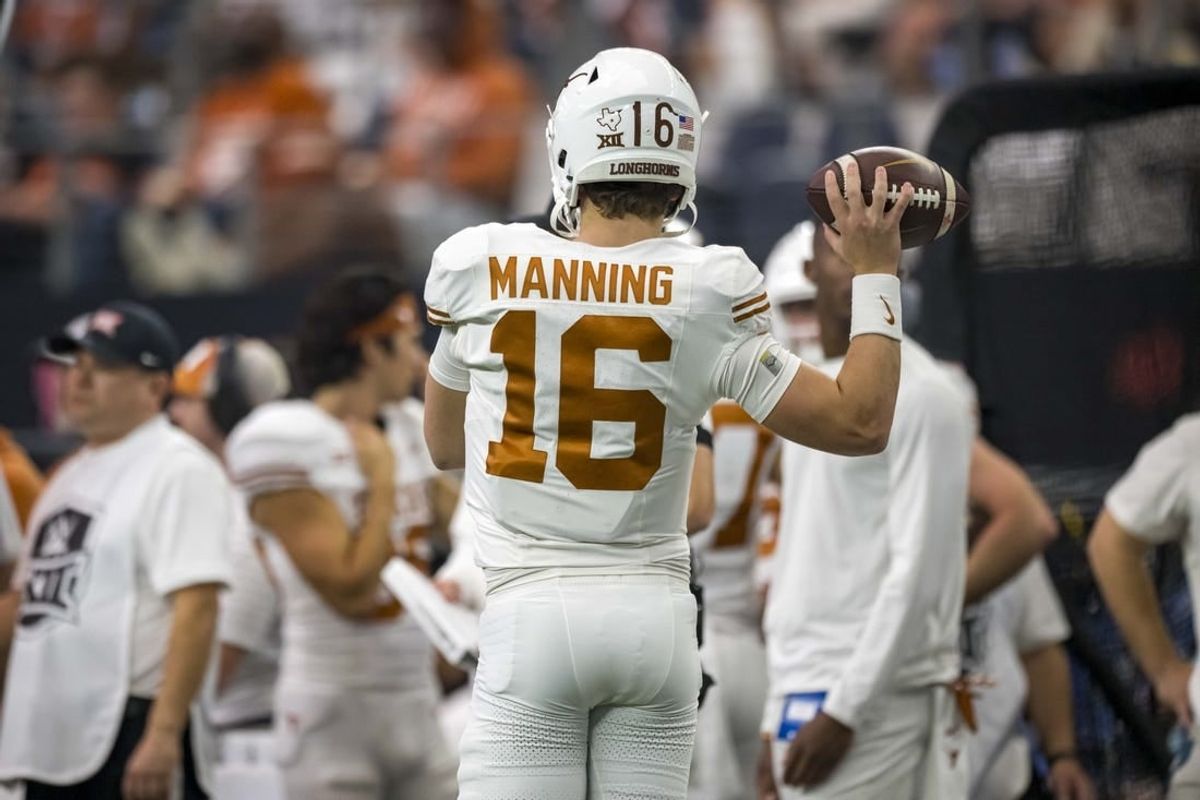 Dec 2, 2023; Arlington, TX, USA; Texas Longhorns quarterback Arch Manning (16) in action during the game between the Texas Longhorns and the Oklahoma State Cowboys at AT&T Stadium.
