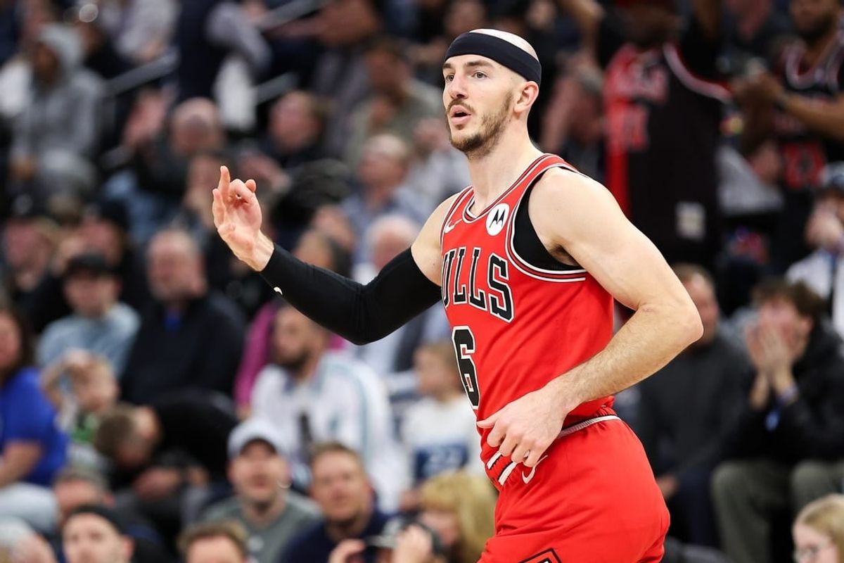 Mar 31, 2024; Minneapolis, Minnesota, USA; Chicago Bulls guard Alex Caruso (6) celebrates his three-point basket against the Minnesota Timberwolves during the second half at Target Center.