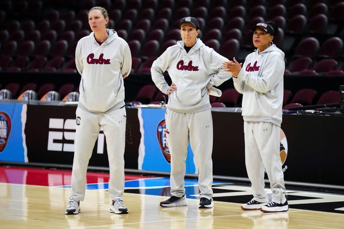 South Carolina Gamecocks assistant coach Mary Wooley (left), associate coach Lisa Boyer (center) and head coach Dawn Staley during practice at Rocket Mortgage FieldHouse.