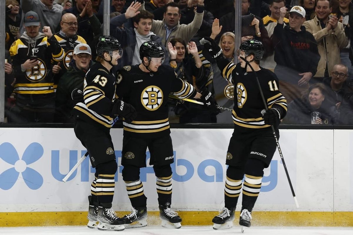 Feb 29, 2024; Boston, Massachusetts, USA; Boston Bruins center Morgan Geekie (39) (center) celebrates his goal with left wing Danton Heinen (43) and center Trent Frederic (11) during the first period against the Vegas Golden Knights at TD Garden.