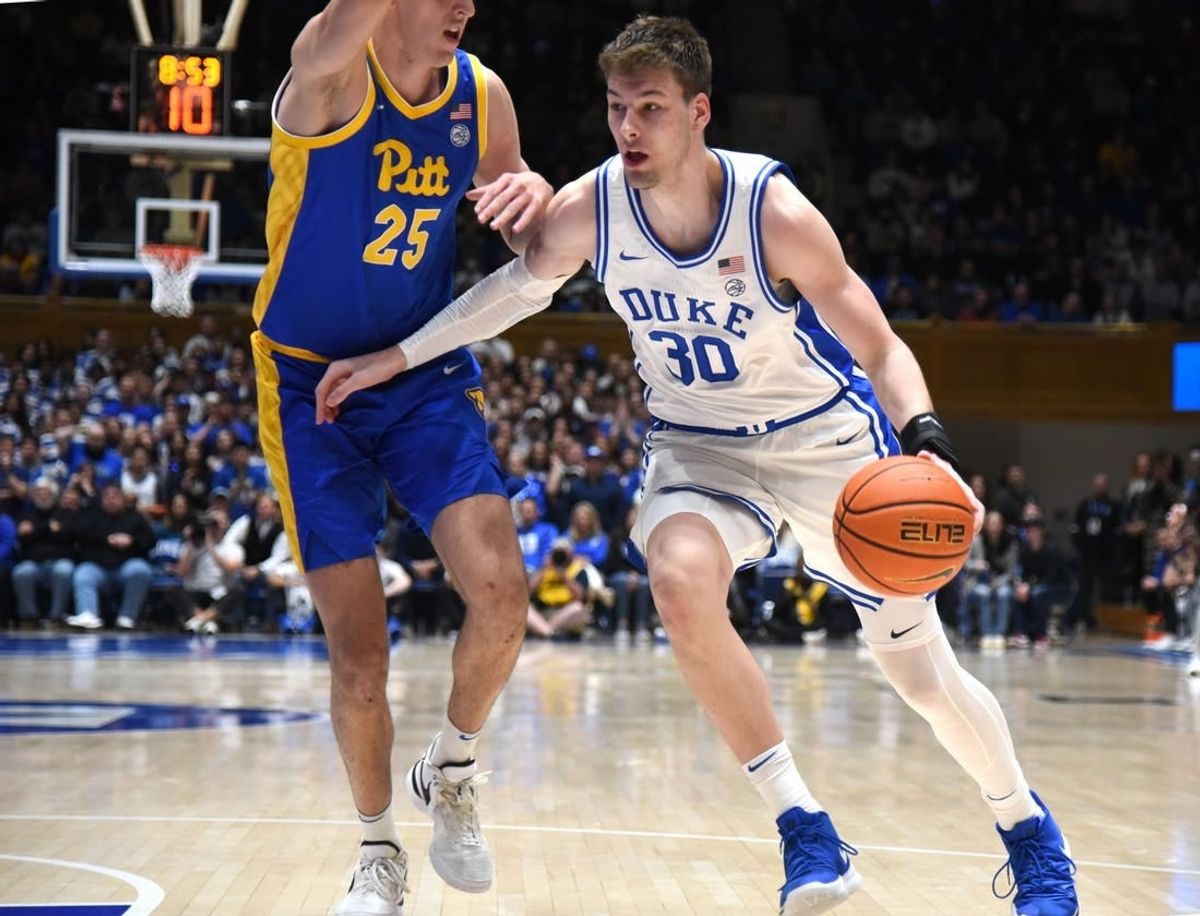Jan 20, 2024; Durham, North Carolina, USA; Duke Blue Devils center Kyle Filipowski (30) drives to the basket as Pittsburgh Panthers forward Guillermo Diaz Graham (25) defends during the second half at Cameron Indoor Stadium.  The Panthers won 80-76.