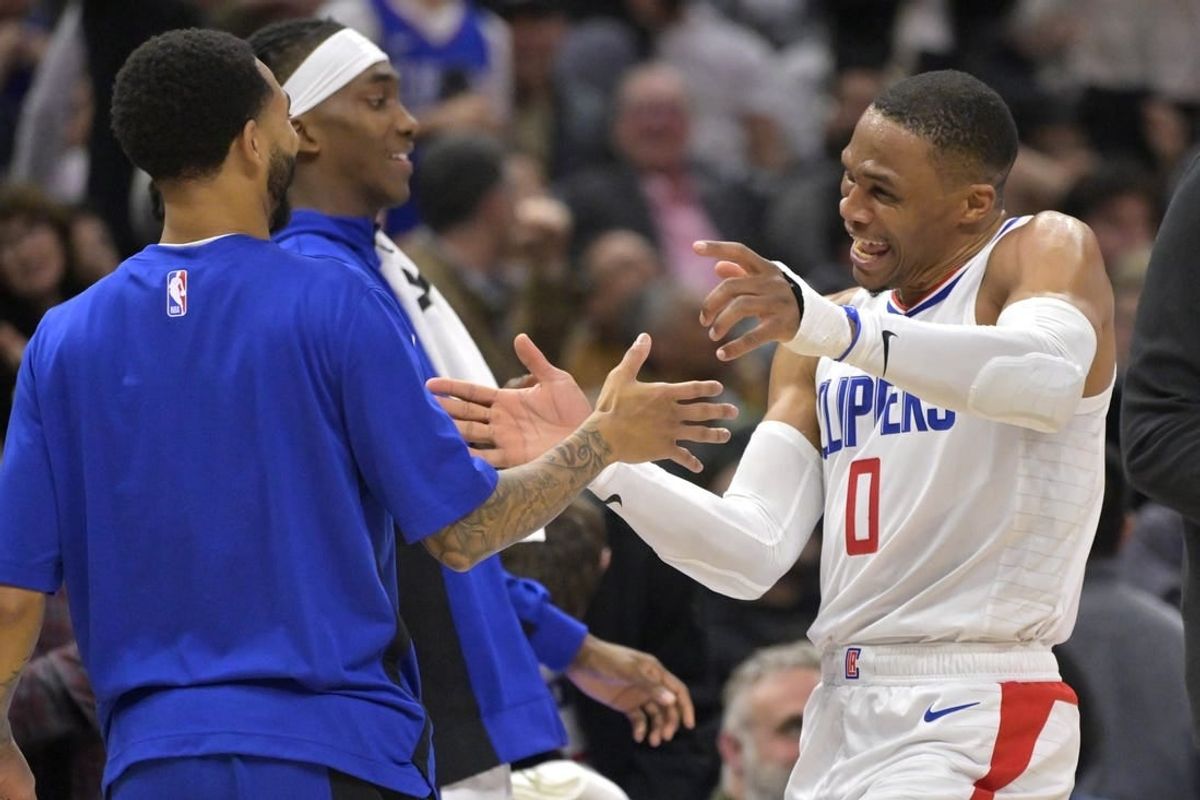 Apr 4, 2024; Los Angeles, California, USA; Los Angeles Clippers guard Russell Westbrook (0) celebrates on the bench in the second half against the Denver Nuggets at Crypto.com Arena.