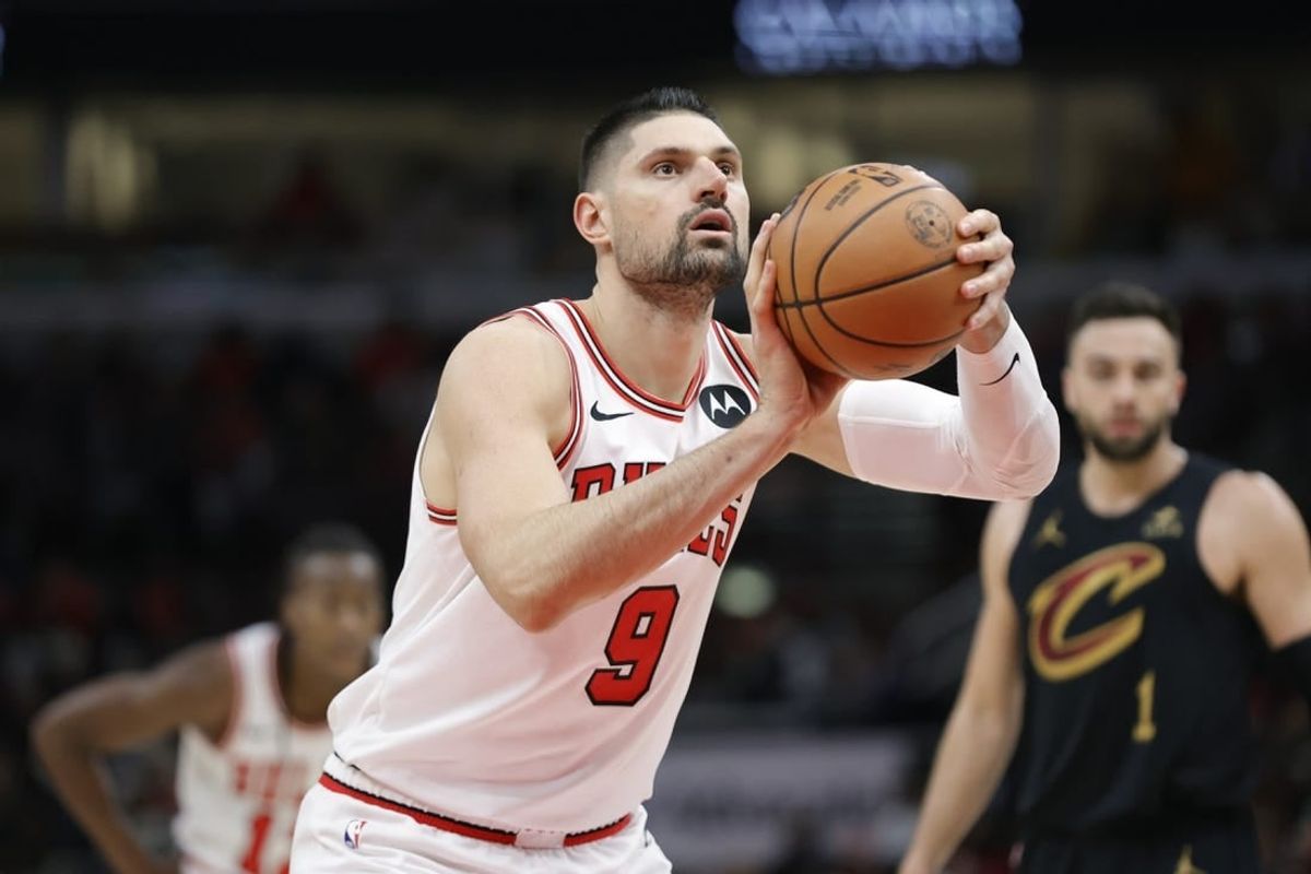 Dec 23, 2023; Chicago, Illinois, USA; Chicago Bulls center Nikola Vucevic (9) shoots a free throw against the Cleveland Cavaliers during the first half at United Center.