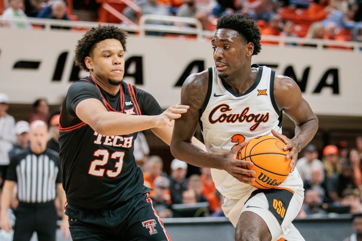 Mar 5, 2024; Stillwater, Oklahoma, USA; Oklahoma State Cowboys forward Eric Dailey Jr. (2) drives around Texas Tech Red Raiders forward Eemeli Yalaho (23) during the first half at Gallagher-Iba Arena.