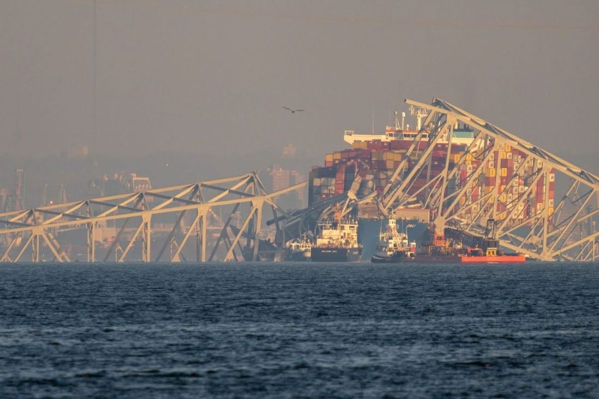 March 31, 2024 : Crane barges and tugboats work during a large salvage operation at the wreckage of the Francis Scott Key Bridge, a major span over the Patapsco River in Baltimore that collapsed after it was struck by a Singapore-flagged container ship 'Dali'. Six road workers were killed in the collapse.