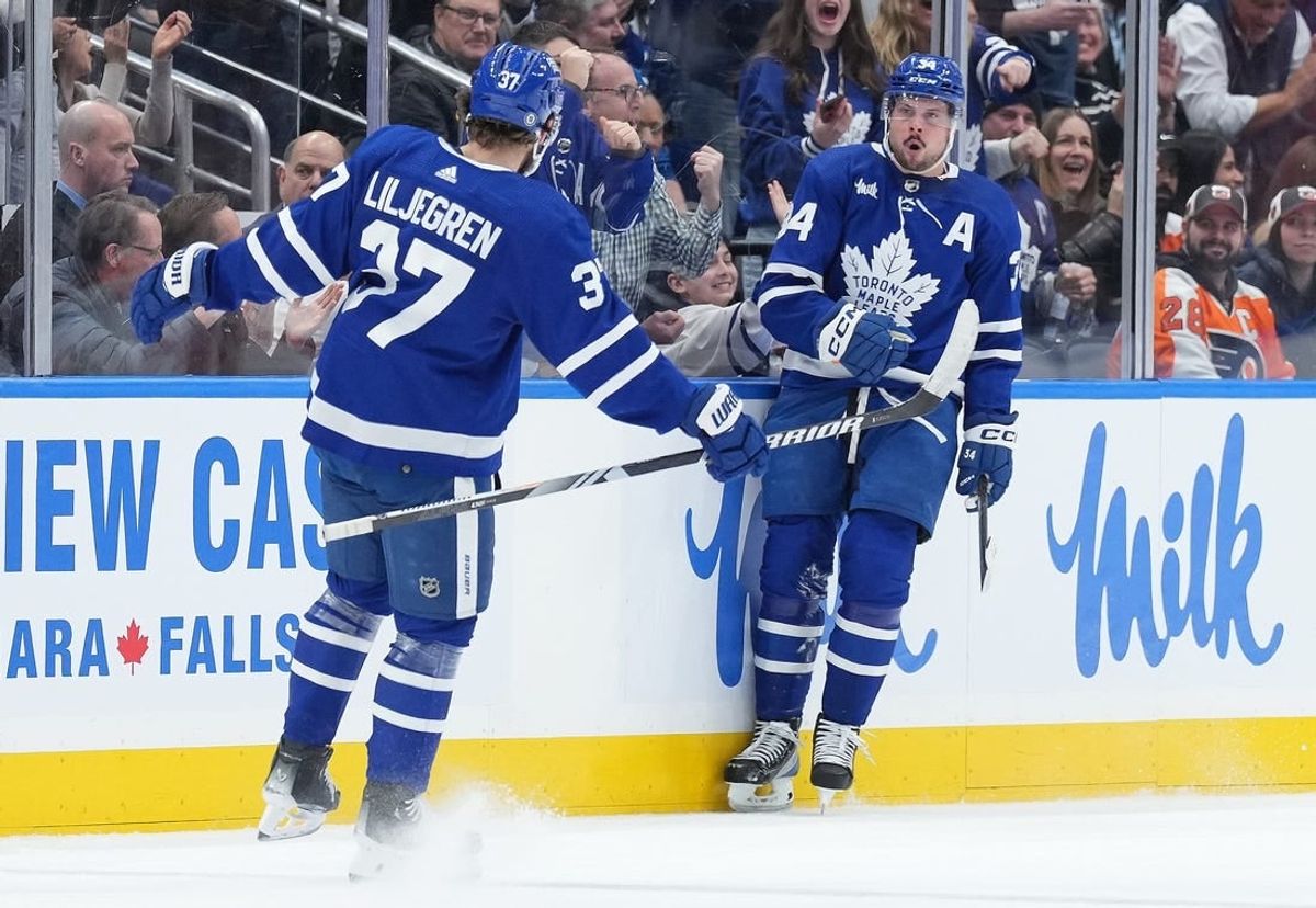 Feb 15, 2024; Toronto, Ontario, CAN; Toronto Maple Leafs center Auston Matthews (34) scores his first goal and celebrates with defenseman Timothy Liljegren (37) against the Philadelphia Flyers during the second period at Scotiabank Arena.