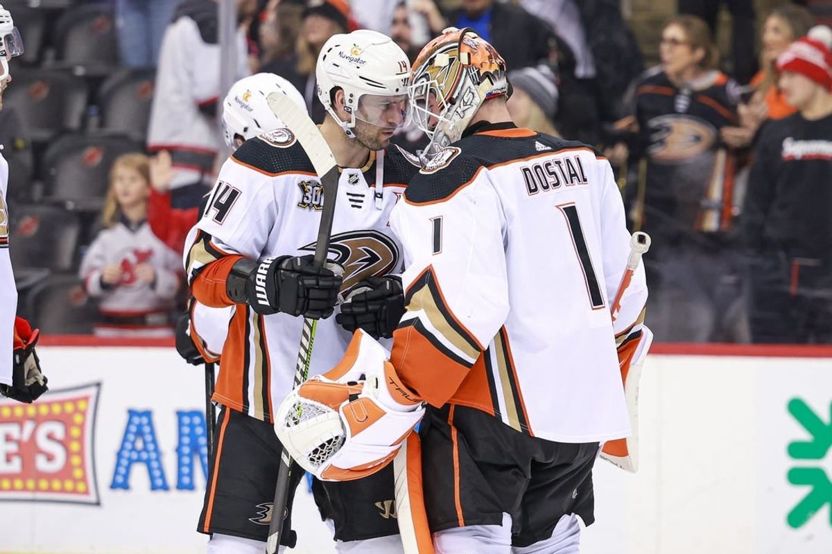 Dec 17, 2023; Newark, New Jersey, USA; Anaheim Ducks center Adam Henrique (14) celebrates with goaltender Lukas Dostal (1) after defeating the New Jersey Devils at Prudential Center.