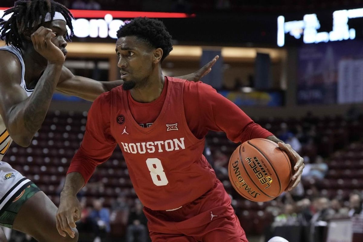 Nov 16, 2023; Charleston, South Carolina, USA; Houston Cougars guard Mylik Wilson (8) drives the ball in the second half against the Towson Tigers at TD Arena.
