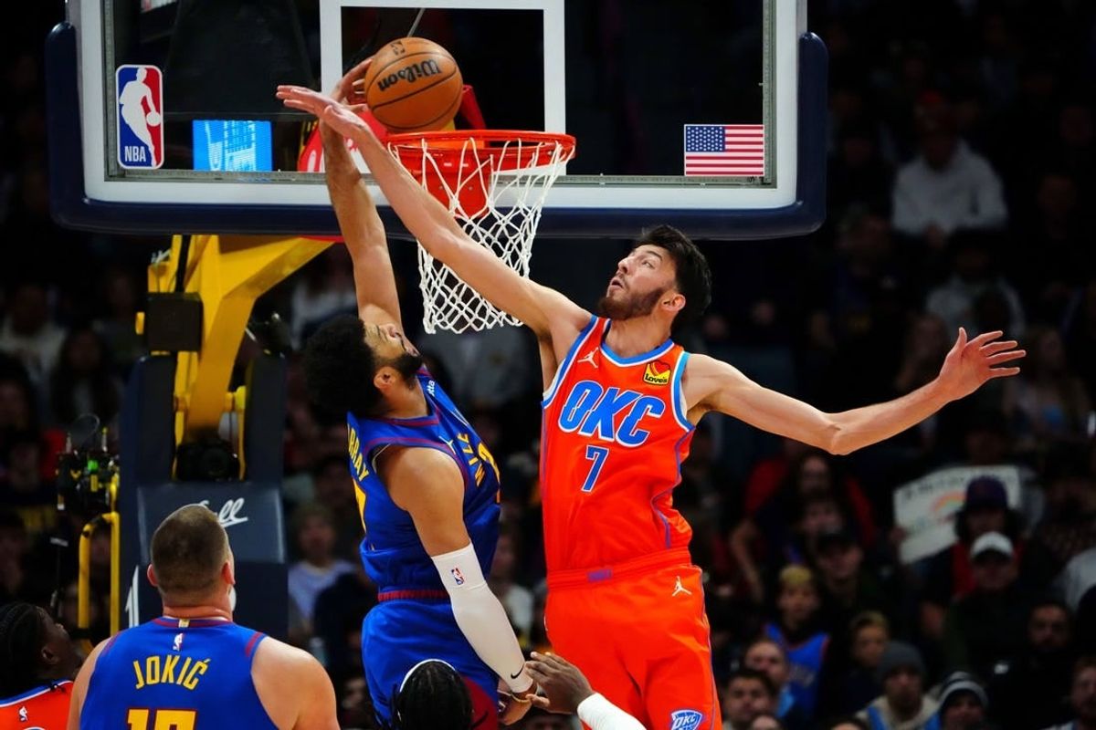 Dec 16, 2023; Denver, Colorado, USA; Denver Nuggets guard Jamal Murray (27) scores against Oklahoma City Thunder forward Chet Holmgren (7) in the first quarter at Ball Arena.