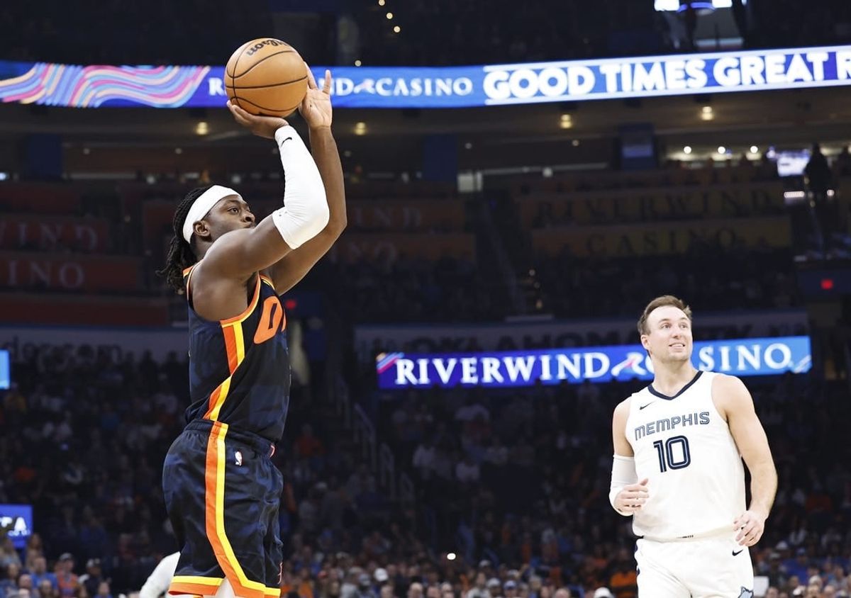 Mar 10, 2024; Oklahoma City, Oklahoma, USA; Oklahoma City Thunder guard Luguentz Dort (5) shoots a three point basket against the Memphis Grizzlies during the second quarter at Paycom Center.