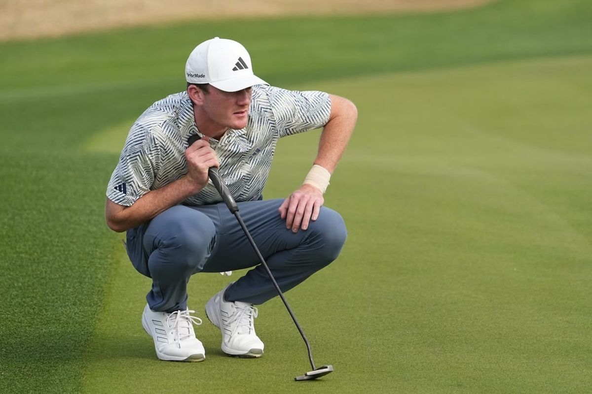 Jan 21, 2024; La Quinta, California, USA; Nick Dunlap lines up a putt on the third green during the final round of The American Express golf tournament at PGA West Stadium Course.