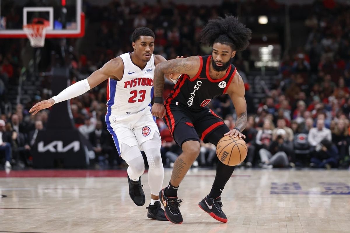 Feb 27, 2024; Chicago, Illinois, USA; Chicago Bulls guard Coby White (0) drives to the basket against Detroit Pistons guard Jaden Ivey (23) during the second half at United Center.