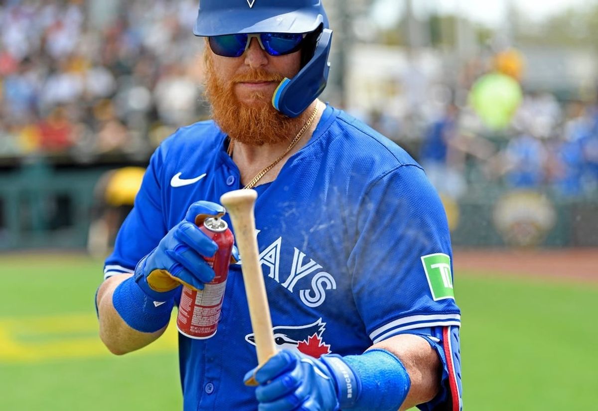 Blue Jays' Justin Turner (#2) uses some spray for a better grip. Pittsburgh Pirates with a dramatic 6-5 win over the Toronto Blue Jays on Tuesday March, 5, 2024, with an official attendance of 5,322 at LECOM Park formerly known as McKechnie Field located in Bradenton, Florida.