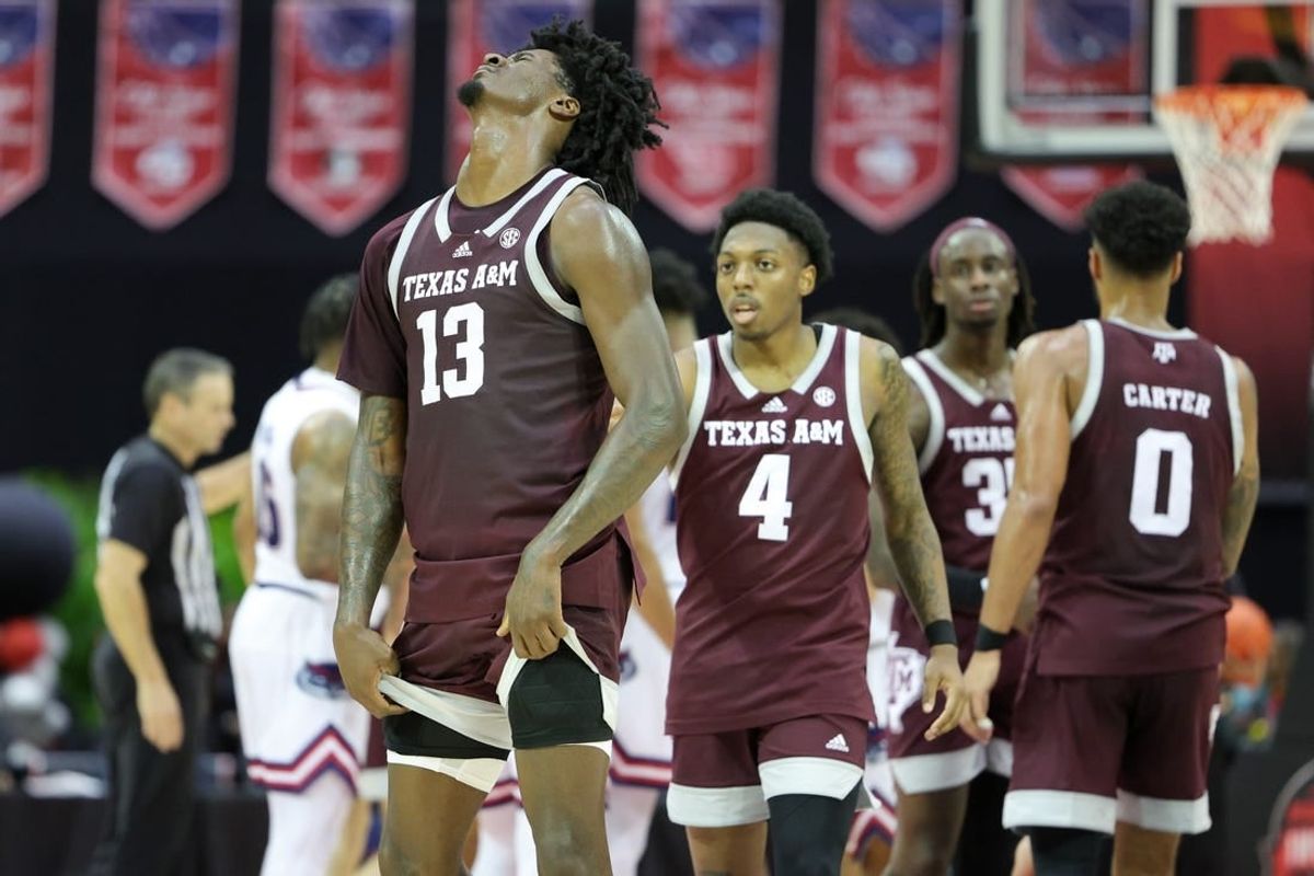 Nov 24, 2023; Kissimmee, FL, USA;  Texas A&M Aggies forward Solomon Washington (13) reacts after a call in a game against the Florida Atlantic Owls in the second half during the ESPN Events Invitational Semifinals at State Farm Field House.